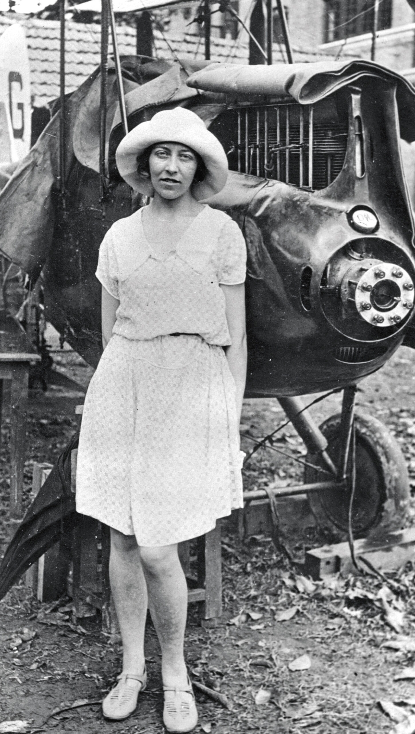 Amy with her badly damaged plane at Insein